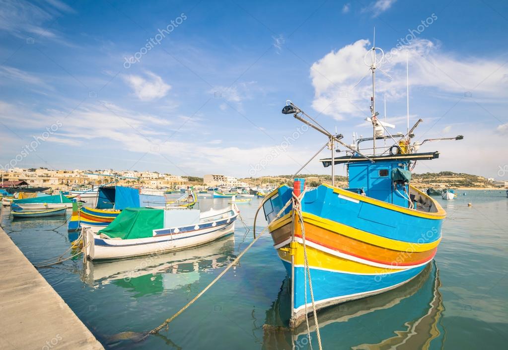 depositphotos_55299181-stock-photo-colorful-typical-boats-in-marsaxlokk